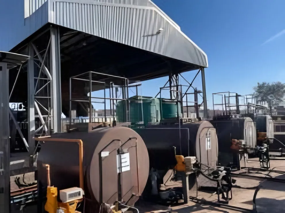 Covered lube bay with bulk oil tanks and dispensing pumps