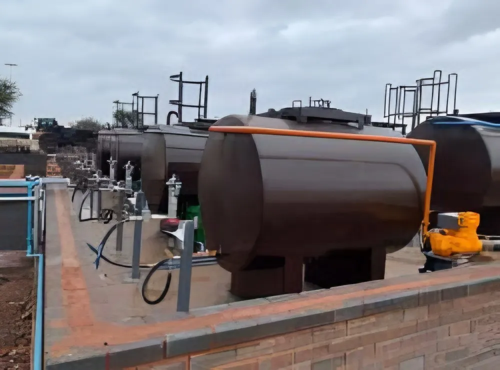 Bulk tanks with pumps mounted on a brick bund