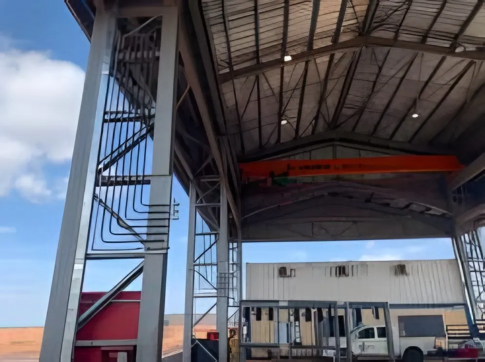 Overhead lube piping on a workshop steel structure