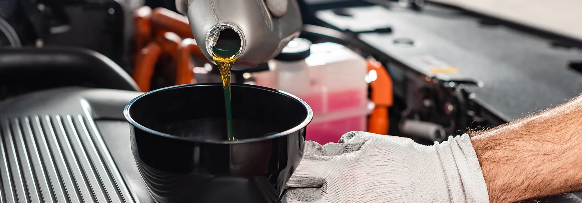 Oil being poured into an engine